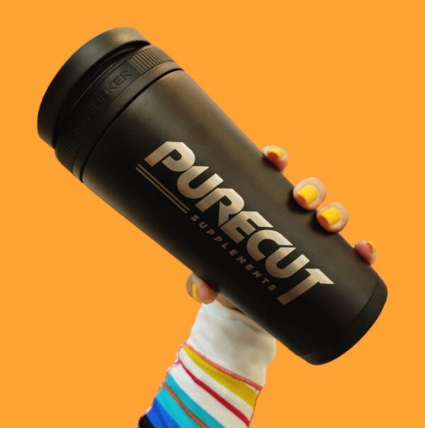 pure cut shaker PureCut Shaker held by hand on orange background